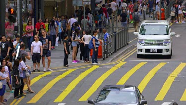 Pedestrians Cross Queens Road, Central, Hong Kong, Asia