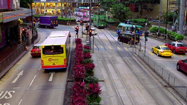Buses, Trams & Pedestrians On Yee Wo Street, Causeway Bay, Hong Kong, China