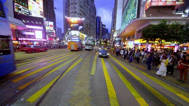 Buses, Trams & Pedestrians On Yee Wo Street, Causeway Bay, Hong Kong, China