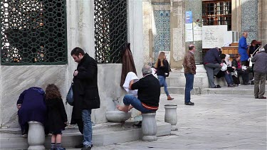 Muslims Washing Feet At New Mosque Fountain, Eminonu, Istanbul, Turkey