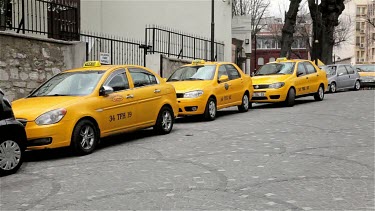 Four Yellow Taxis On Street, Sultanahmet, Istanbul, Turkey