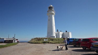 Lighthouse & Woman Walking Two Dogs, Flamborough Head, East Yorkshire, England