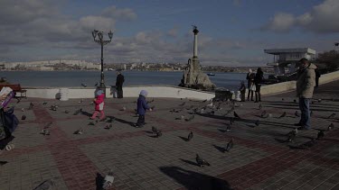 Young Boy Chases Pigeons, Sevastopol, Crimea, Ukraine