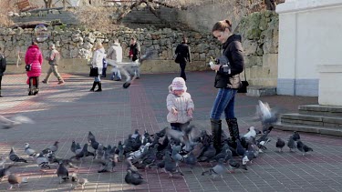 Woman & Child Feed Pigeons, Sevastopol, Crimea, Ukraine