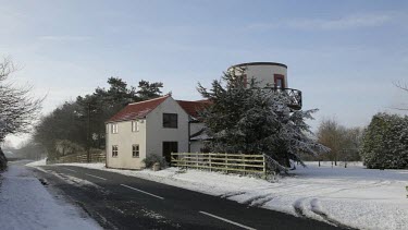 Windmill Style House In Snow, Cayton Bay, North Yorkshire, England