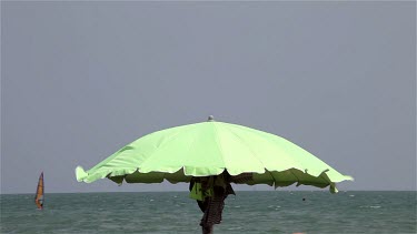 Lime Green Parasol In Wind, Lido, Venice, Italy