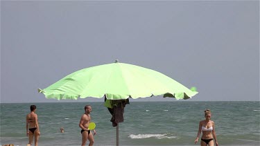 Lime Green Parasol In Wind, Lido, Venice, Italy