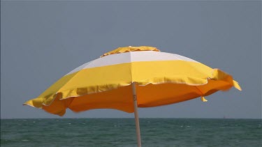 Yellow & White Parasol In Wind, Lido, Venice, Italy