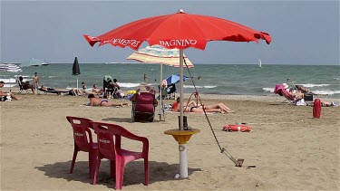 Red Parasol In Wind, Lido, Venice, Italy