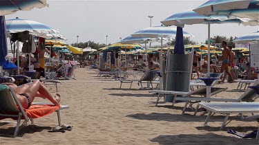 Beach Lounge Beds & Parasols In Wind, Lido, Venice, Italy