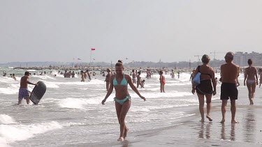 CM0094-APL-0060360 Woman In Light Green Bikini Runs On Beach, Lido, Venice, Italy