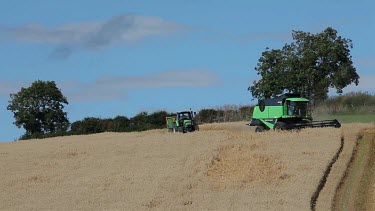Tractor & Combined Harvester In Field, North Yorkshire, England