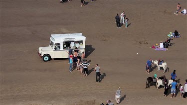 Ice Cream Queue On Beach, Whitby, North Yorkshire, England