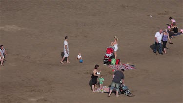 People & Deck Chairs At Beach, Whitby, North Yorkshire, England