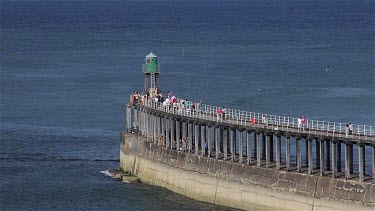 Walking On West Pier, Whitby, North Yorkshire, England