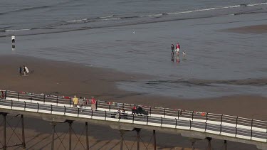 People Walking On Pier & Beach, Saltburn-By-The-Sea, North Yorkshire, England