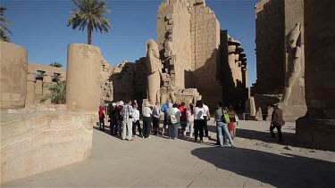 Tourists At Colossus Of Ramses Ii In Temple Of Amun, Karnak, Luxor, Egypt
