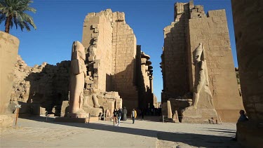 Toursits At Colossus Of Ramses Ii, Temple Of Amun, Karnak, Luxor, Egypt