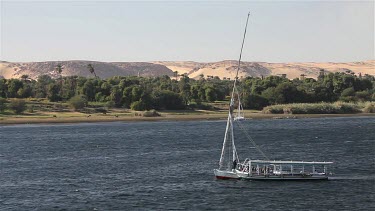Felucca Tows Passenger Boat, Aswan, Egypt