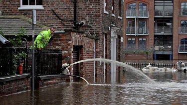 Workman Pump Floodwater From Houses, City Of York, England