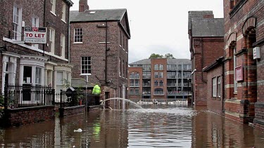 Workman Pump Floodwater From Houses, City Of York, England