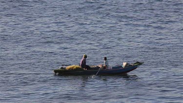 Locals In Rowing Boat On River Nile, Aswan, Egypt