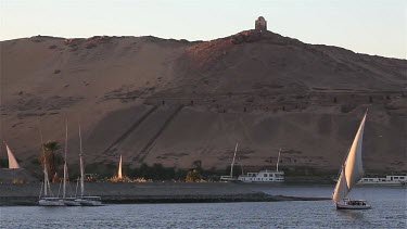 Felucca In Full Sail & Tombs Of The Nobles, River Nile, Aswan, Egypt