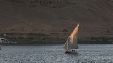 Felucca In Full Sail & Passenger Ferry, River Nile, Aswan, Egypt