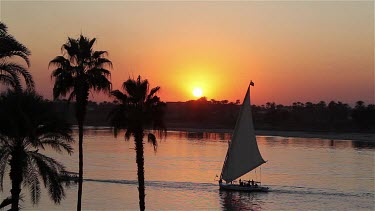 Felucca & Ferry At Sunset, River Nile, Luxor, Egypt