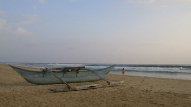 Fibreglass Fishing Boat & Woman In Bikini, Bentota Beach, Sri Lanka