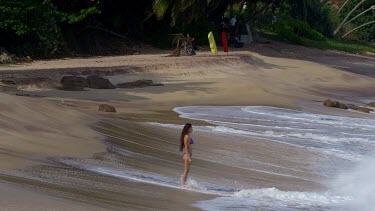 Woman In Surf On Indian Ocean Beach, Tangalle, Sri Lanka