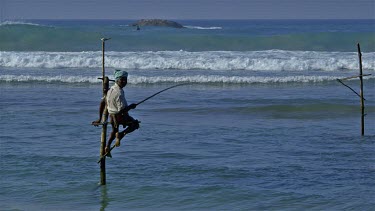 Lone Stilt Fisherman & Surfers, Weligama, Sri Lanka, Asia