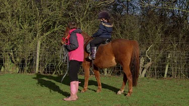 Teaching Girl To Ride Pony, Catwick, East Yorkshire, England
