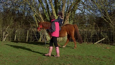 Teaching Girl To Ride Pony, Catwick, East Yorkshire, England