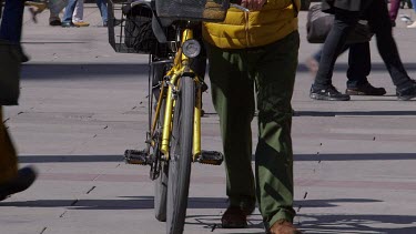 Legs Walking With Yellow Bicycle, Marienplatz, Munich, Germany