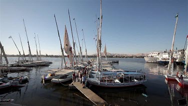 Moored Feluccas & Passenger Ferries, River Nile, Luxor, Egypt