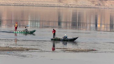 Fishermen On Rowing Boats Bringing In Nets, River Nile, Luxor, Egypt