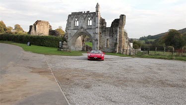 Red Ferrari 458 Spider Car & Kirkham Priory, Malton, North Yorkshire, England