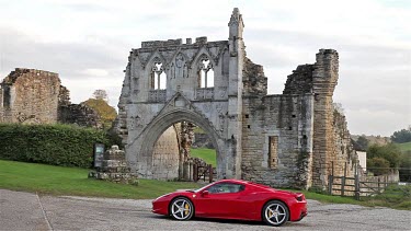 Red Ferrari 458 Spider Car & Kirkham Priory, Malton, North Yorkshire, England