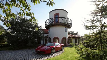 Red Ferrari 458 Spider Car & Windmill House, Scarborough, North Yorkshire, England