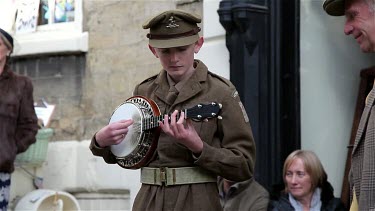 Boy In Wwii Uniform Plays Ukulele, Pickering, North Yorkshire, England