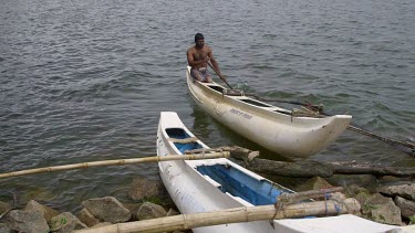 Canoe Fisherman Comes To Shore, Kala Wewa Lake, Sri Lanka